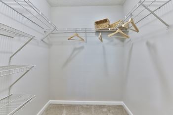 A walk in closet in a 555 waverly unit